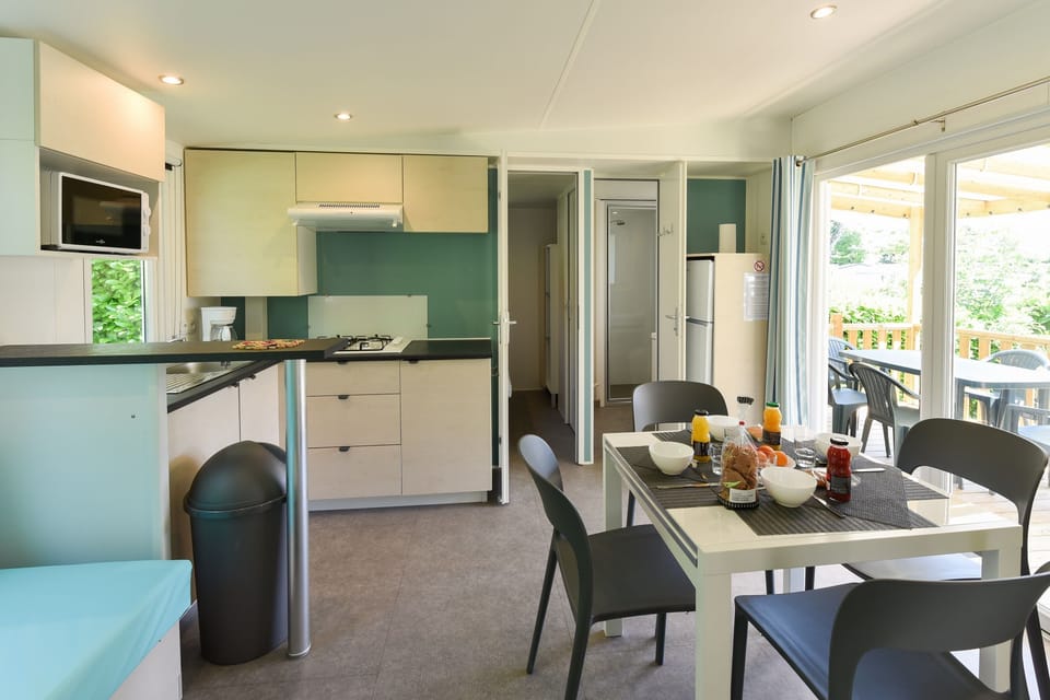 Premium Mobile Home (Caélia - Trois Chambres ) | Living area | Foosball, table tennis, books