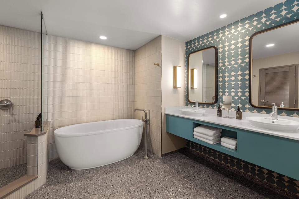 Suite, 1 Bedroom (with Living Area) | Bathroom | Shower, designer toiletries, hair dryer, towels