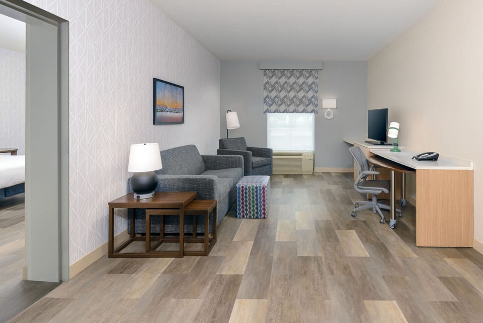 Desk, laptop workspace, blackout drapes, iron/ironing board