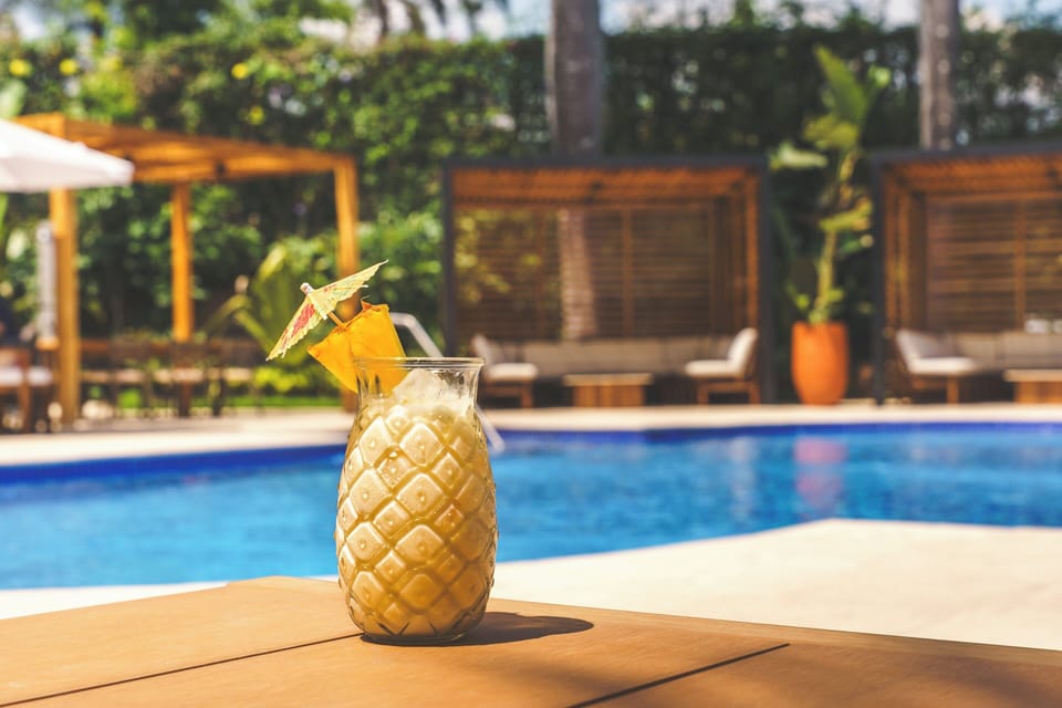 Outdoor pool, open 6:30 AM to 10:00 PM, pool umbrellas, sun loungers