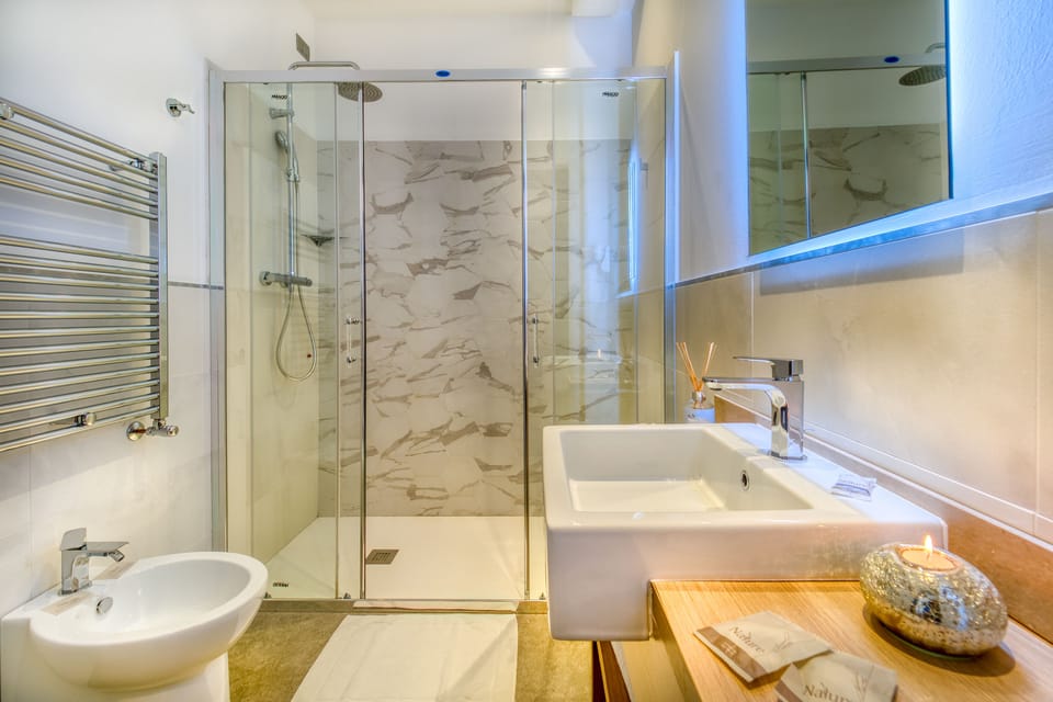 Shower, free toiletries, hair dryer, slippers