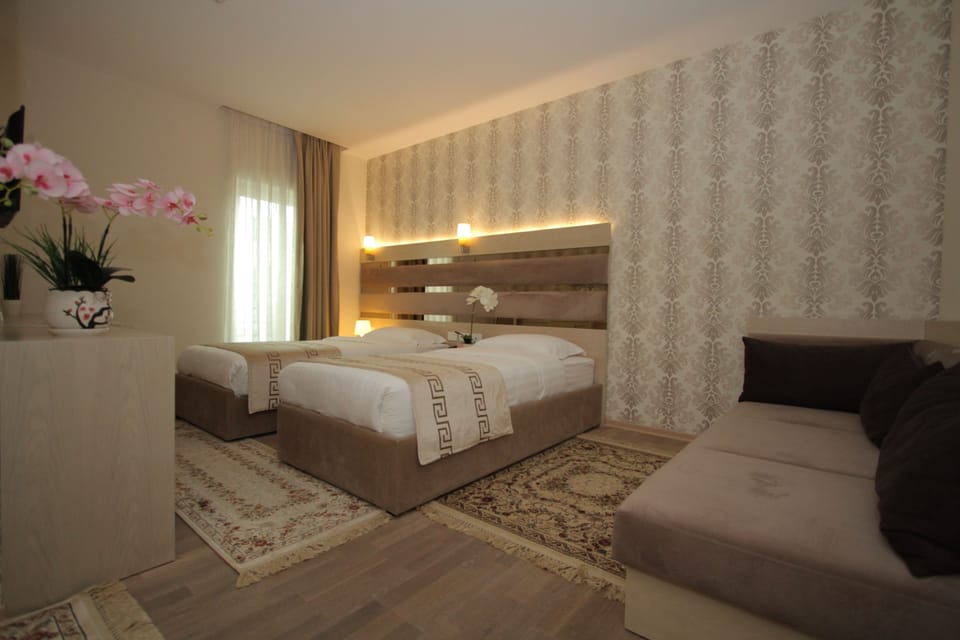 Twin Room | Minibar, in-room safe, desk, soundproofing