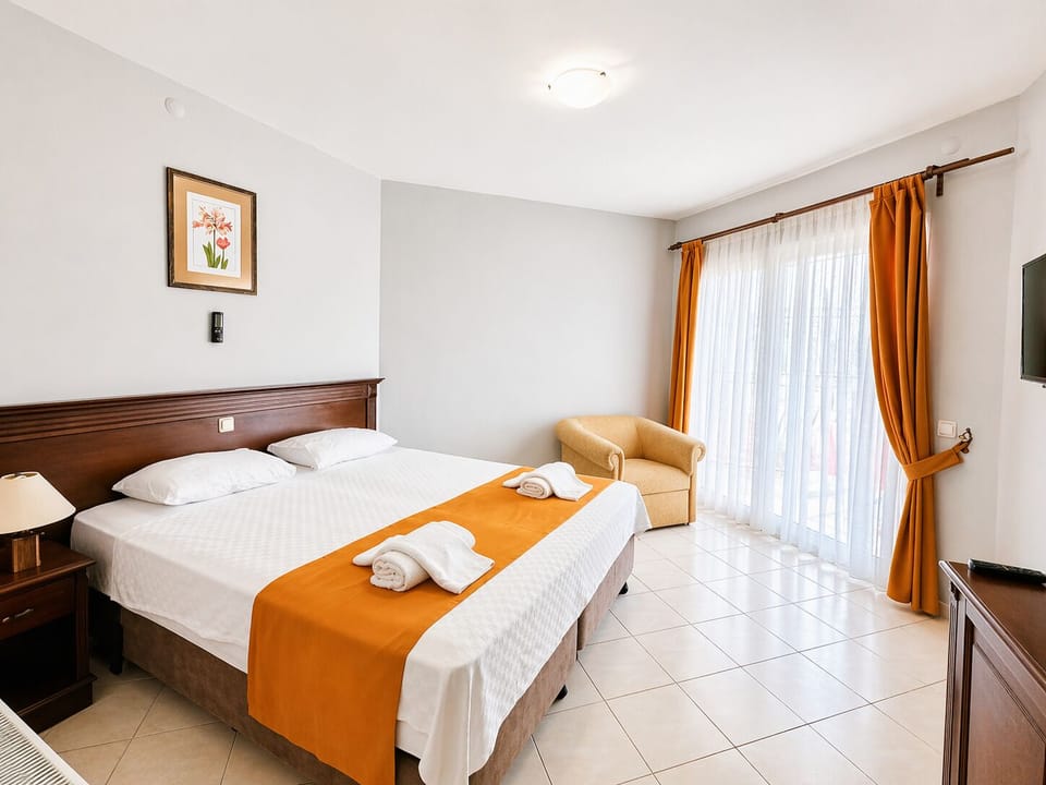 Standard Double or Twin Room | Minibar, in-room safe, desk, iron/ironing board
