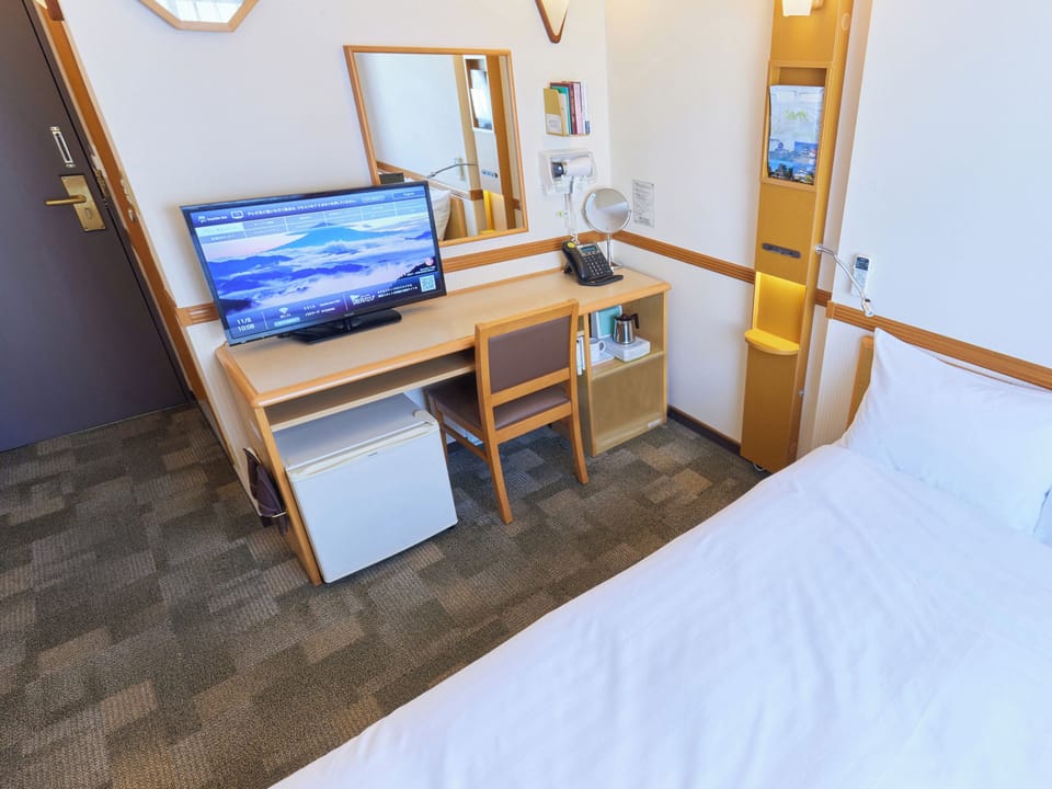 Desk, laptop workspace, free WiFi, bed sheets