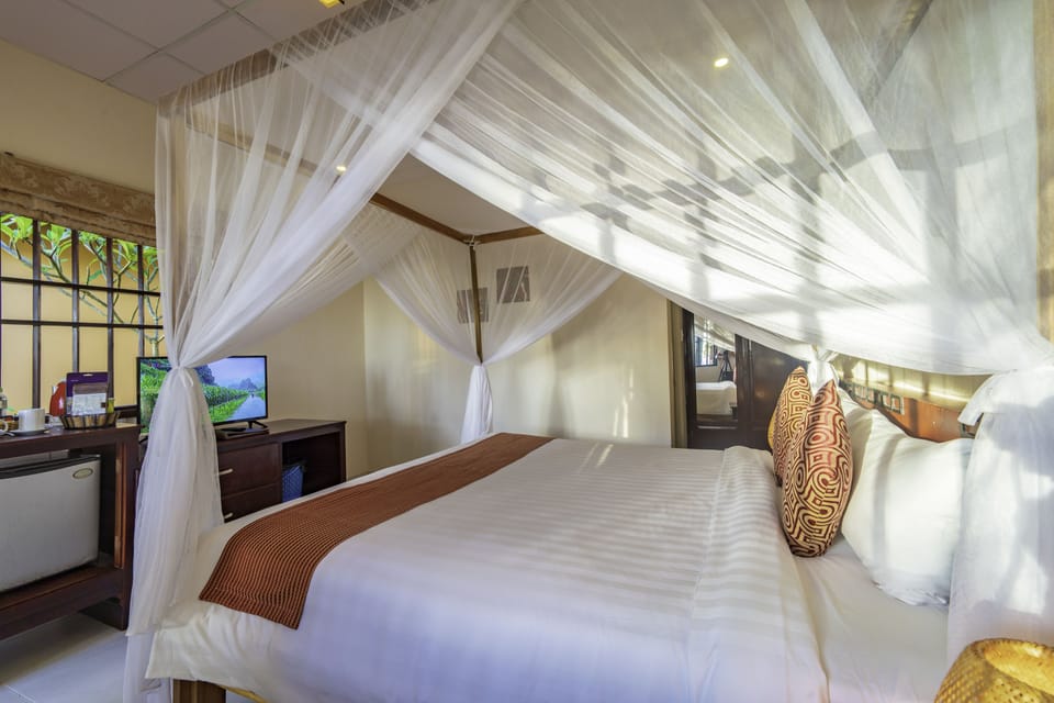 Superior Bungalow | Minibar, in-room safe, desk, blackout drapes
