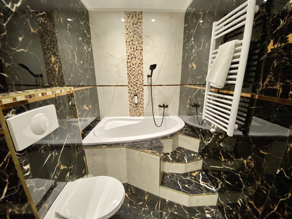 Royal Studio Suite, 1 Bedroom, City View | Bathroom | Free toiletries, hair dryer, towels, toilet paper