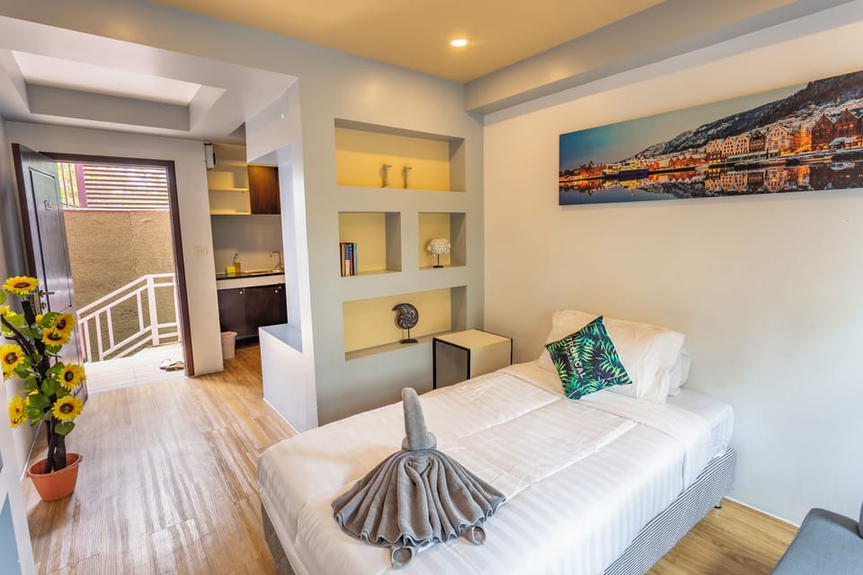 Deluxe Suite, Multiple Beds | Living area | LED TV