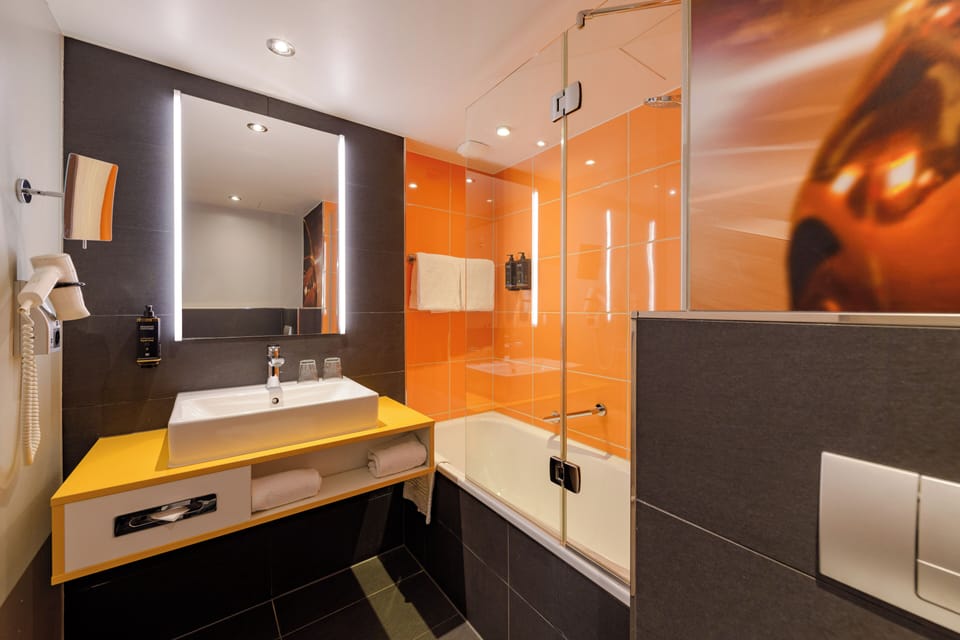 Standard Room, Multiple Beds | Bathroom | Combined shower/tub, eco-friendly toiletries, hair dryer, towels