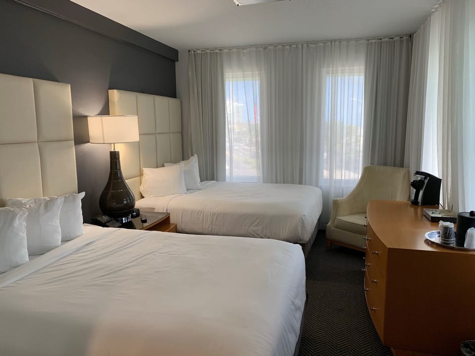 Suite, Multiple Beds (Two Bedroom Suite w/ Two Queens and O) | Premium bedding, in-room safe, blackout drapes, iron/ironing board