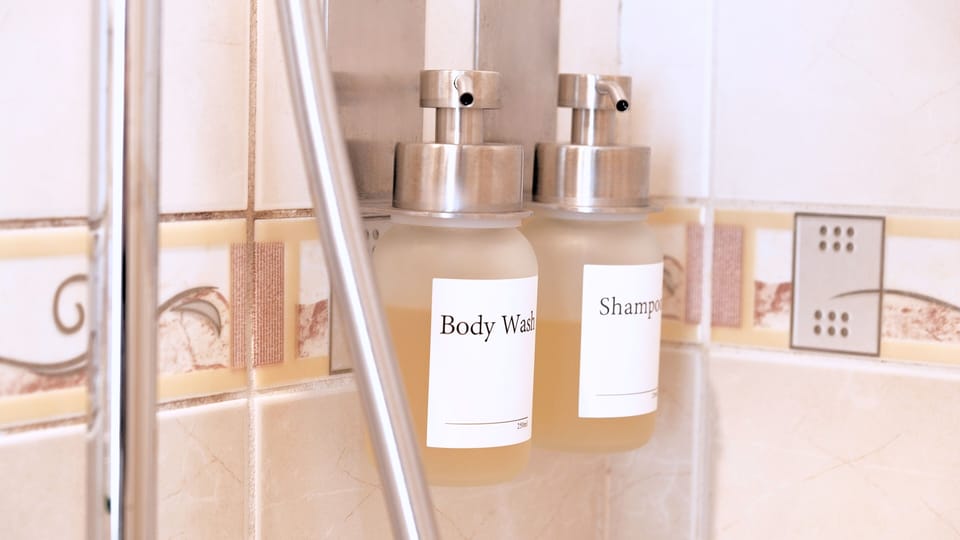 Basic Double Room | Bathroom | Shower, hair dryer, slippers, towels