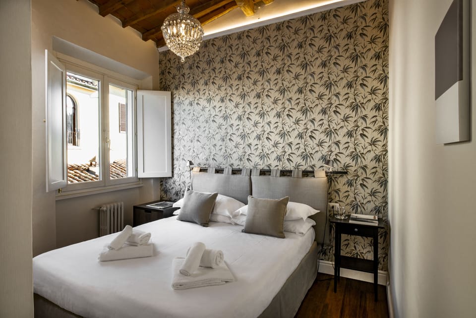 Premium bedding, down comforters, minibar, in-room safe