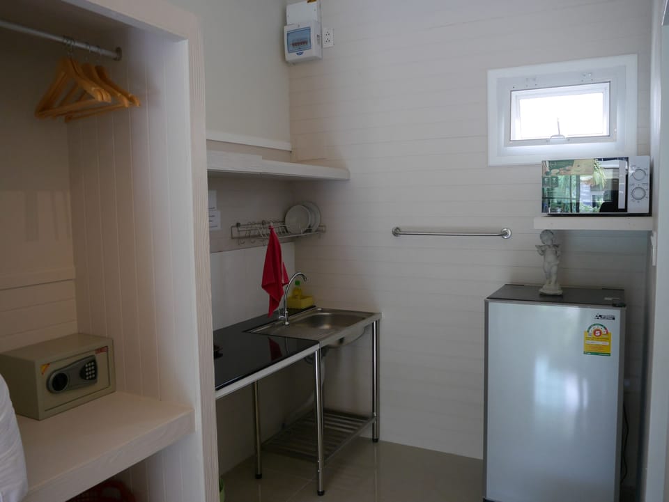 Fridge, microwave, electric kettle, cookware/dishes/utensils