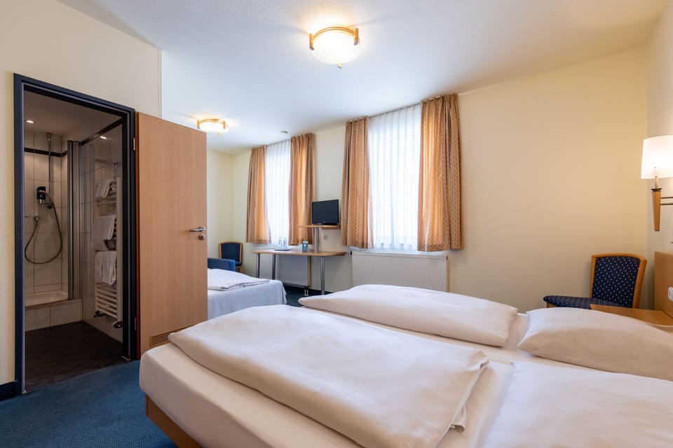 Triple Room | Premium bedding, blackout drapes, iron/ironing board, free WiFi