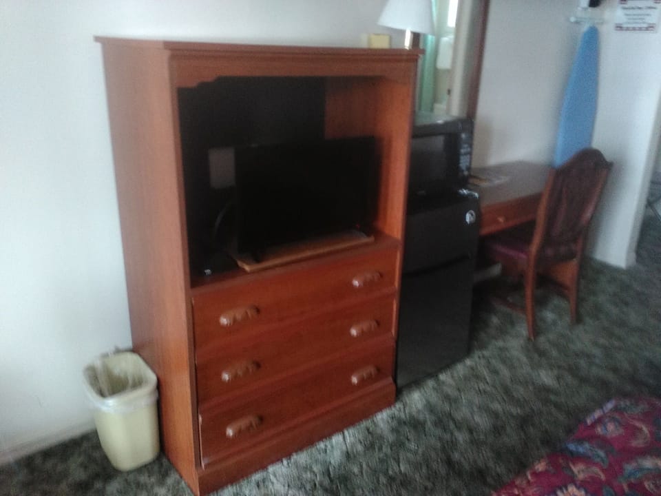 Desk, blackout drapes, iron/ironing board, bed sheets