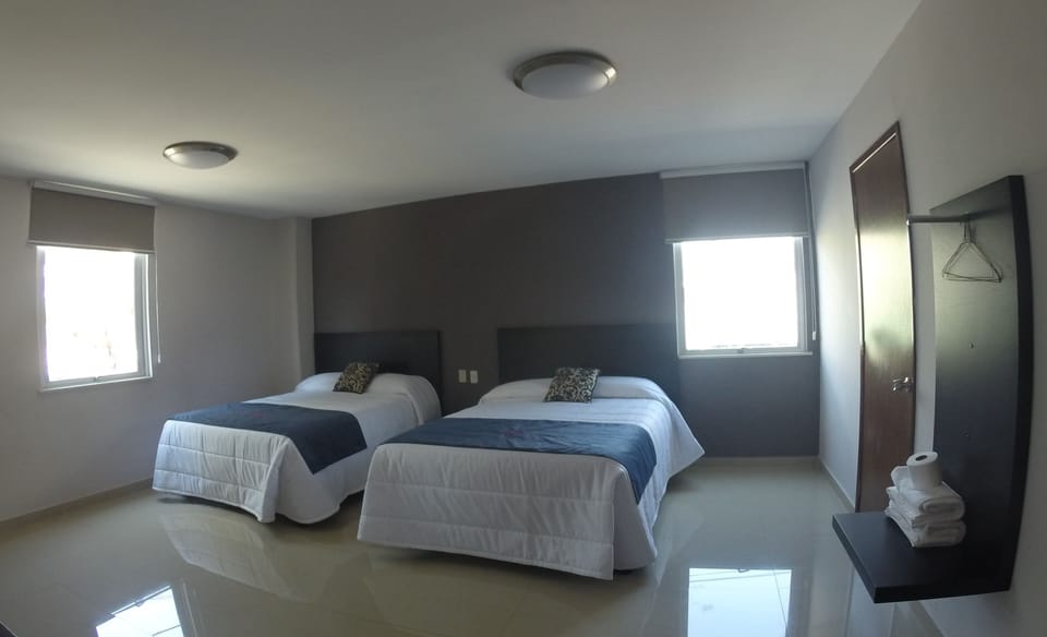 Deluxe Room, 2 Queen Beds | Free WiFi, bed sheets