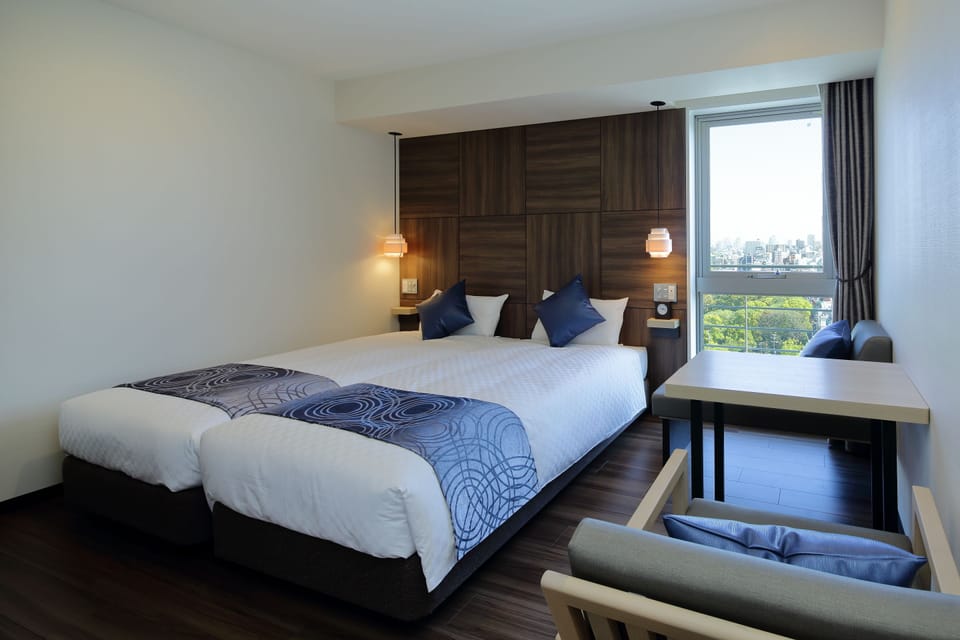 Twin Room, Non Smoking | Down comforters, desk, blackout drapes, iron/ironing board
