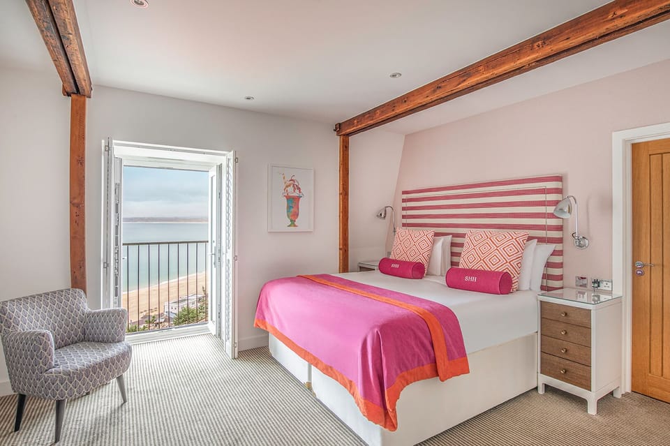 Deluxe Double Room, Sea View | 1 bedroom, desk, laptop workspace, iron/ironing board