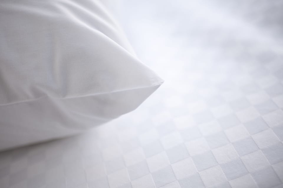 Premium bedding, pillowtop beds, desk, laptop workspace