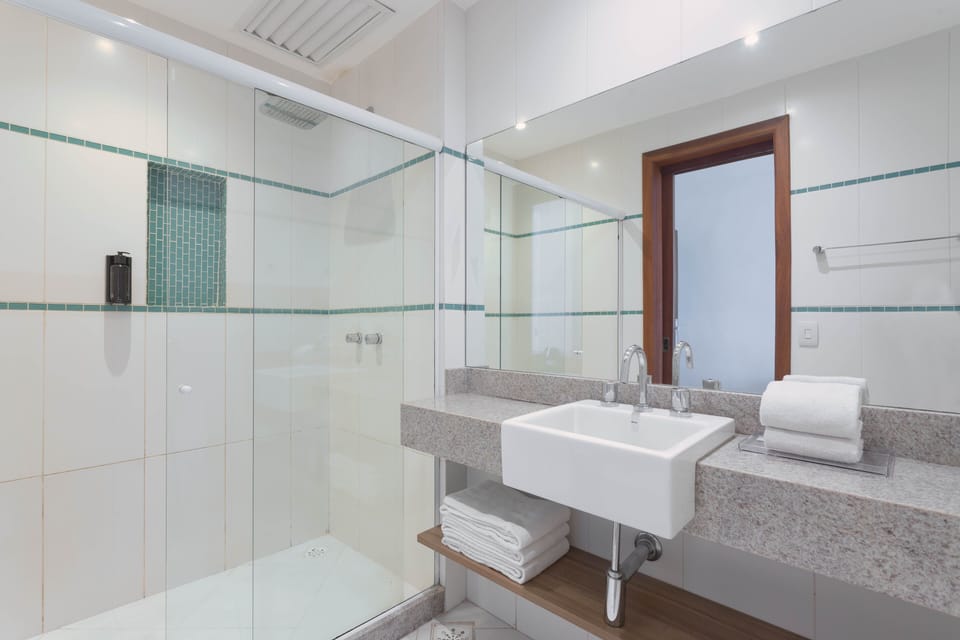 Superior Suite, 1 Bedroom | Bathroom | Shower, hair dryer, towels