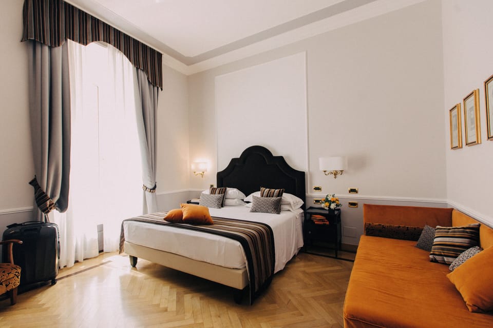 Deluxe Double Room | Minibar, in-room safe, individually decorated, individually furnished
