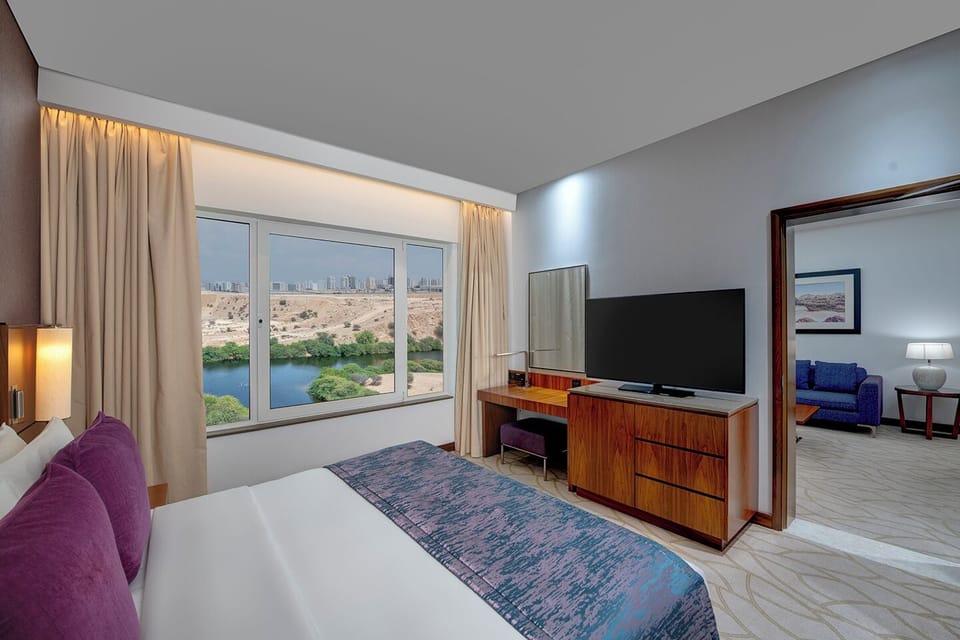 Suite, 1 Bedroom, Garden View | 1 bedroom, down comforters, memory foam beds, minibar