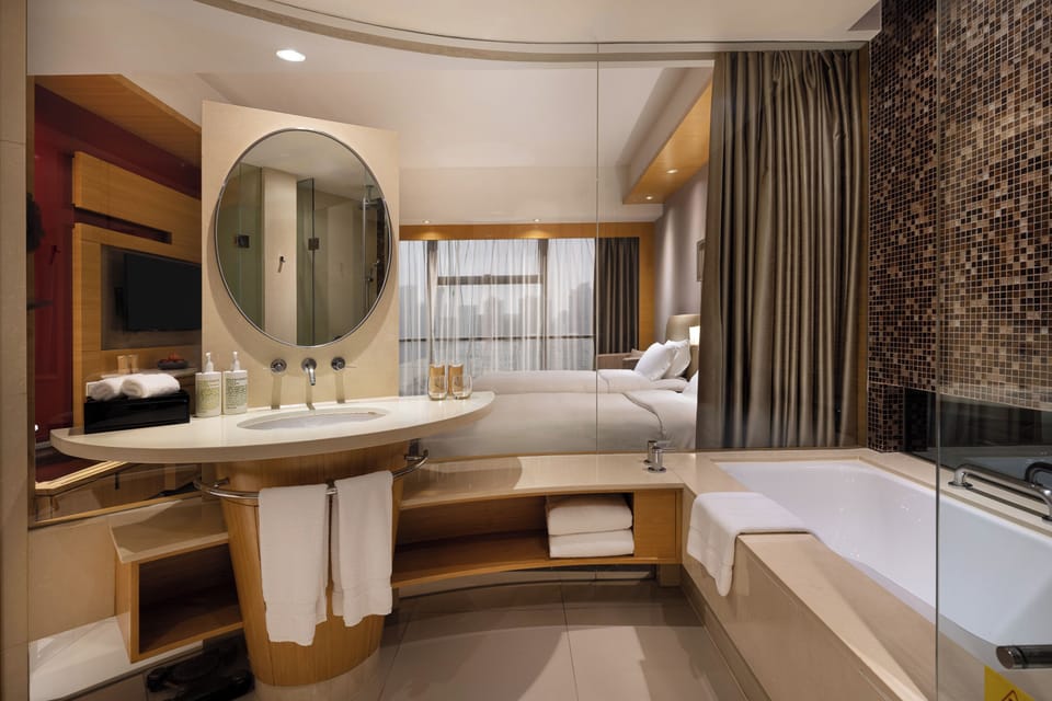 Separate tub and shower, rainfall showerhead, free toiletries