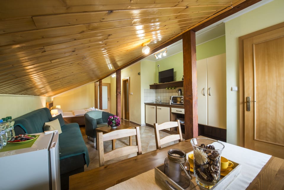 Deluxe Apartment, Kitchenette | Living area | Flat-screen TV