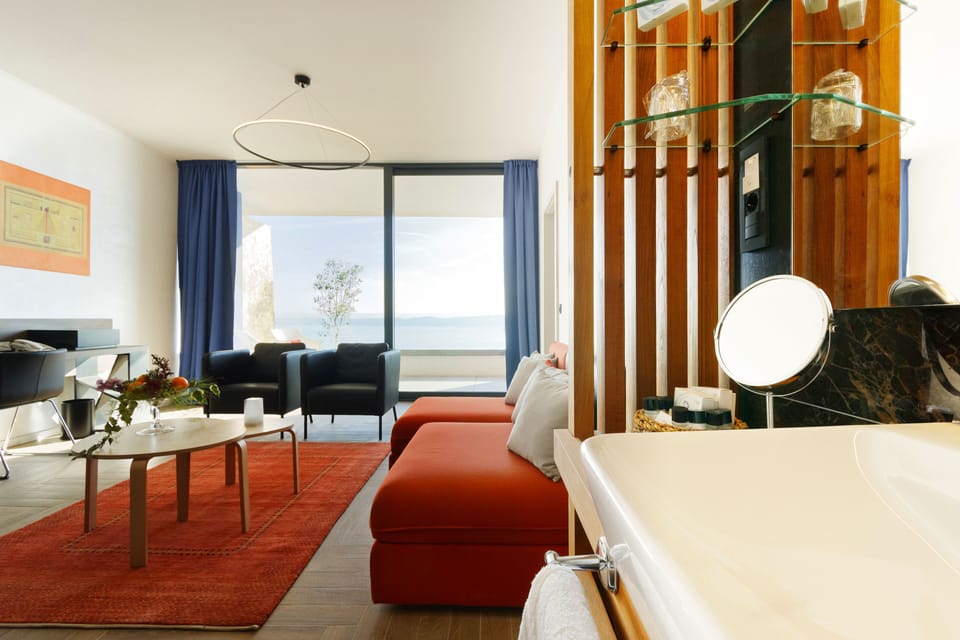 Deluxe Suite, Balcony, Sea View | Living area | 32-inch LCD TV with premium channels, TV