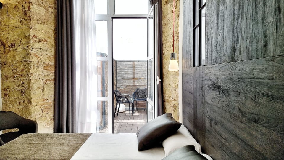 Interior Double Room with Patio | In-room safe, desk, laptop workspace, blackout drapes