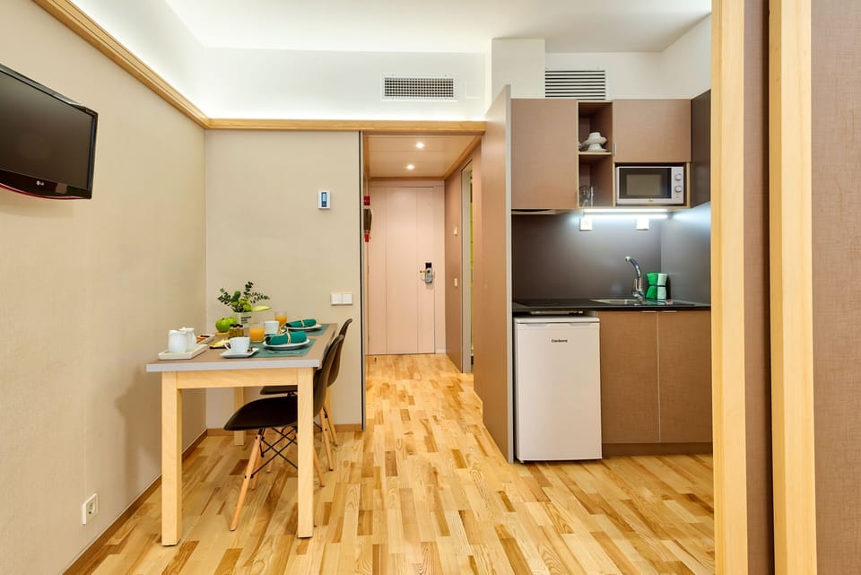 Standard Suite, Kitchenette | Minibar, in-room safe, desk, laptop workspace
