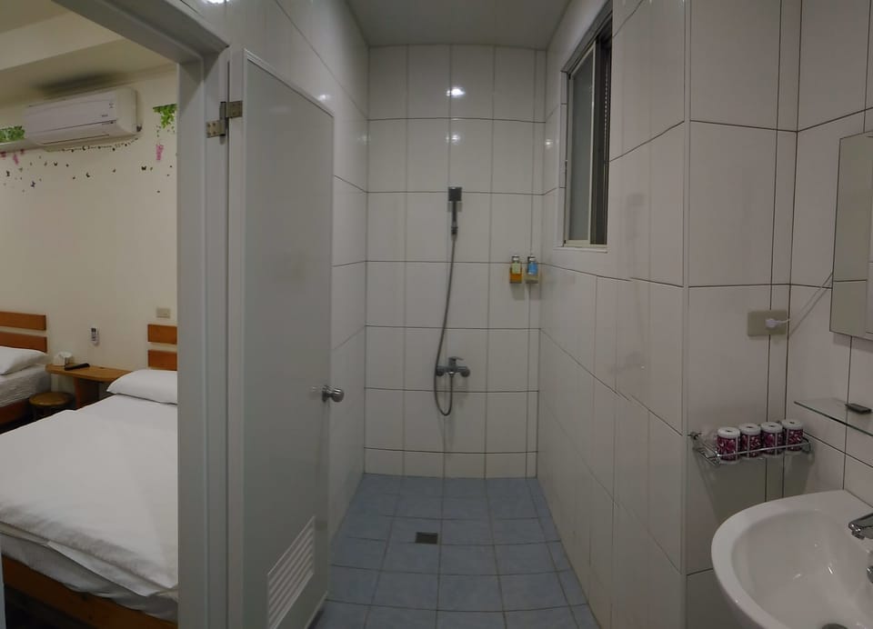 Economy Quadruple Room, 2 Bedrooms | Bathroom | Shower, free toiletries, hair dryer, slippers