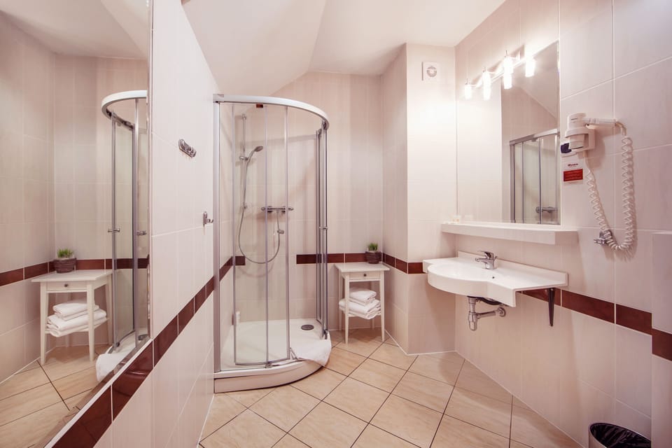 Shower, free toiletries, hair dryer, slippers