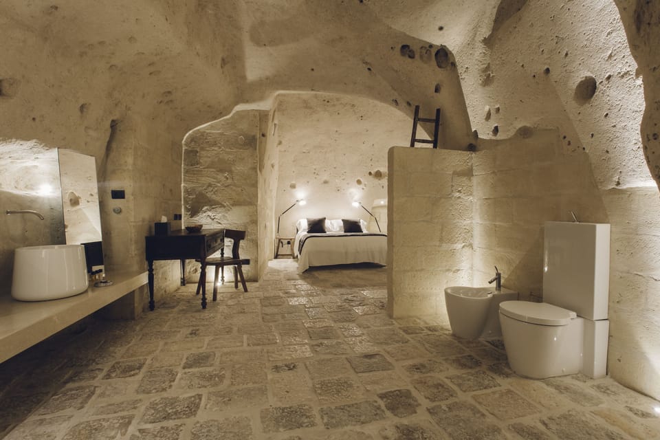 Deluxe Room | Bathroom | Designer toiletries, hair dryer, towels, soap