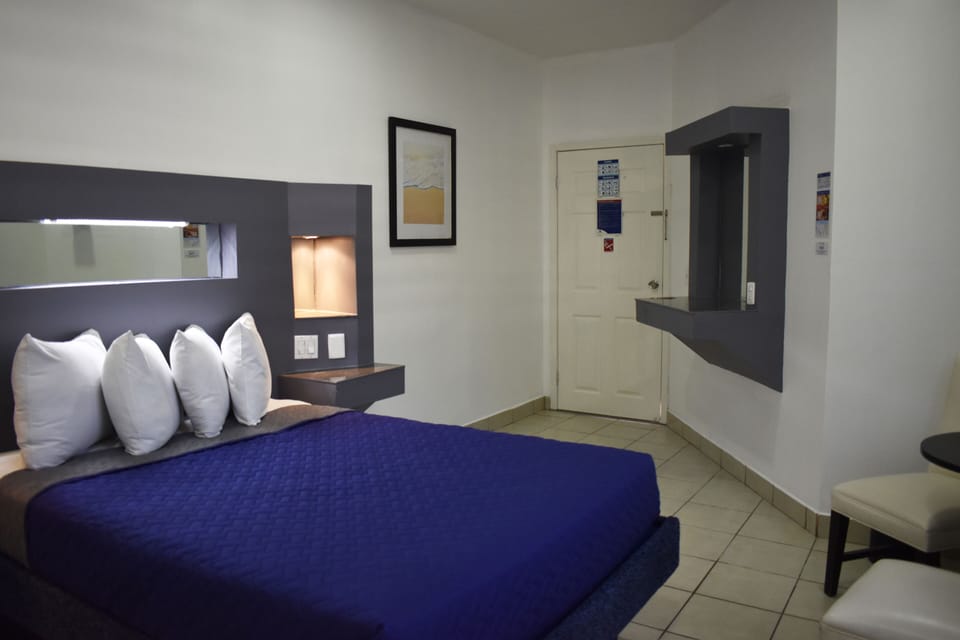 Standard Room, 1 Queen Bed | Individually furnished, iron/ironing board, free WiFi