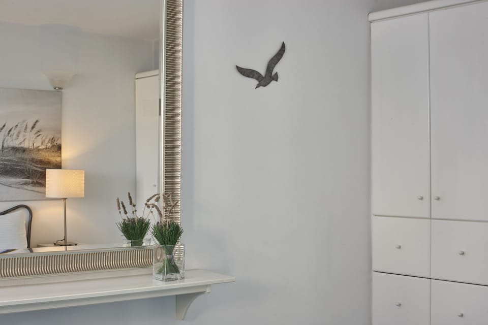 Villa | Living area | Flat-screen TV, fireplace, DVD player, books