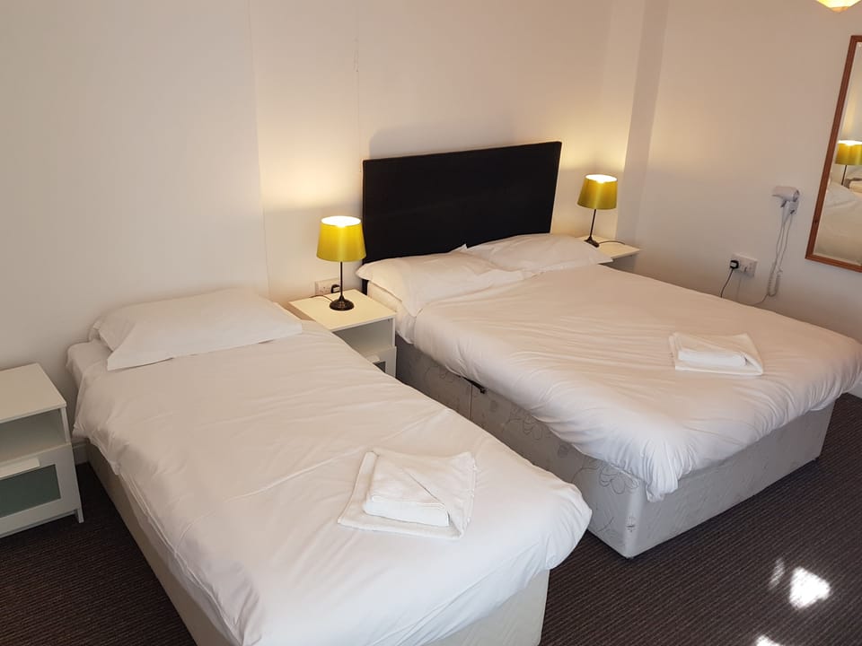 Family Room | Iron/ironing board, bed sheets