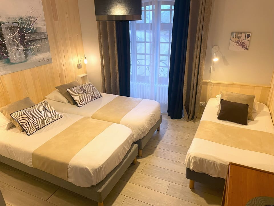 Triple Room | Desk, blackout drapes, free WiFi