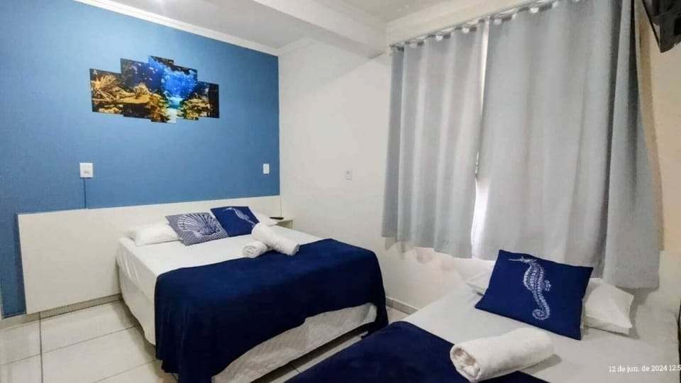 Economy Triple Room, 1 Bedroom | Minibar, free WiFi, bed sheets