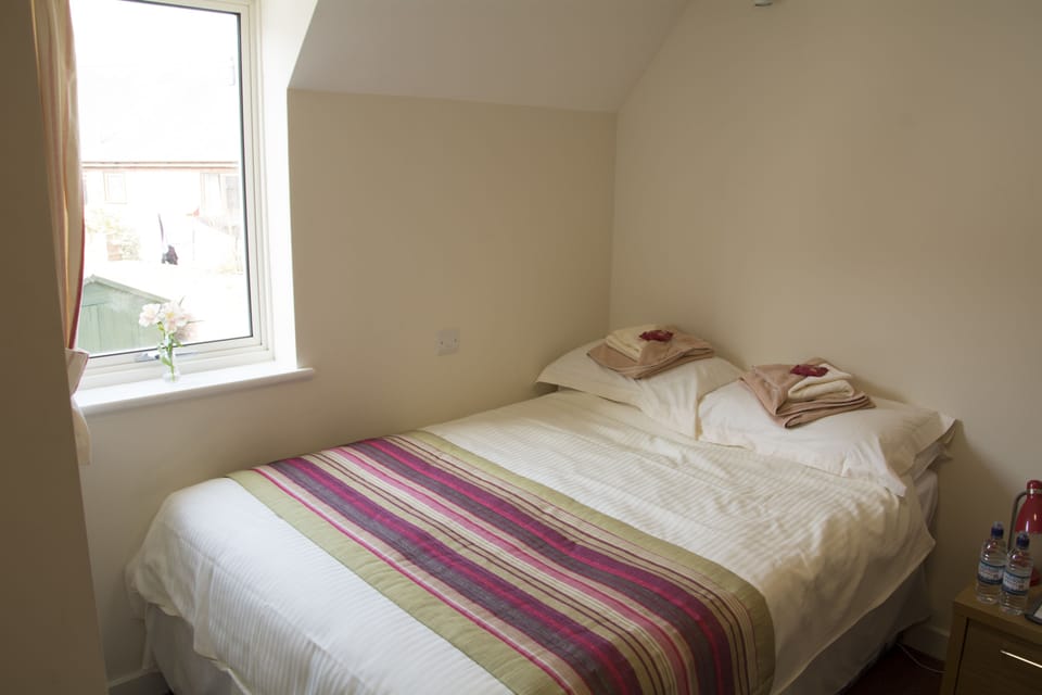 Family Room | Laptop workspace, iron/ironing board, free WiFi, bed sheets
