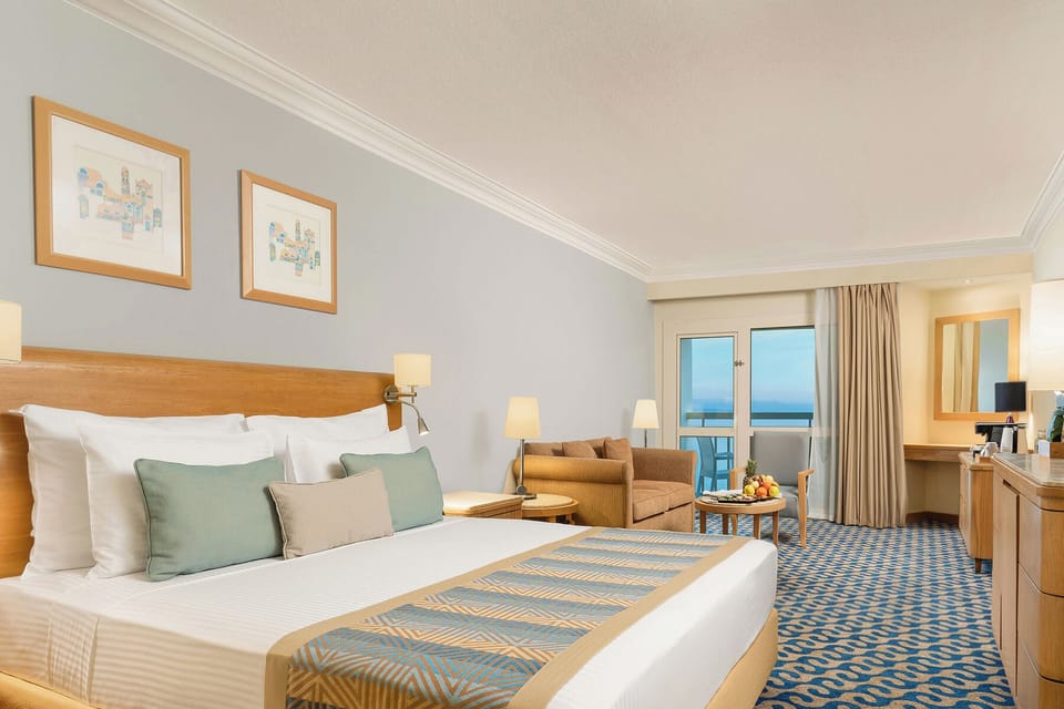 Junior Suite | Minibar, in-room safe, blackout drapes, iron/ironing board (on request)