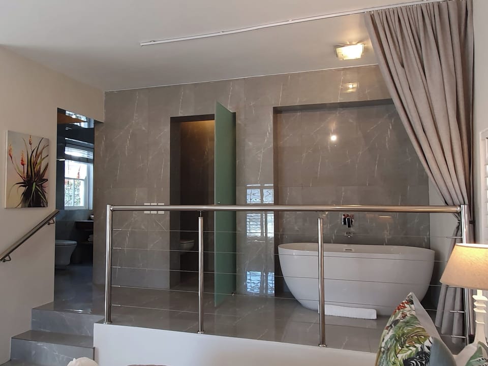Premier Suite | Bathroom | Designer toiletries, hair dryer, bathrobes, towels