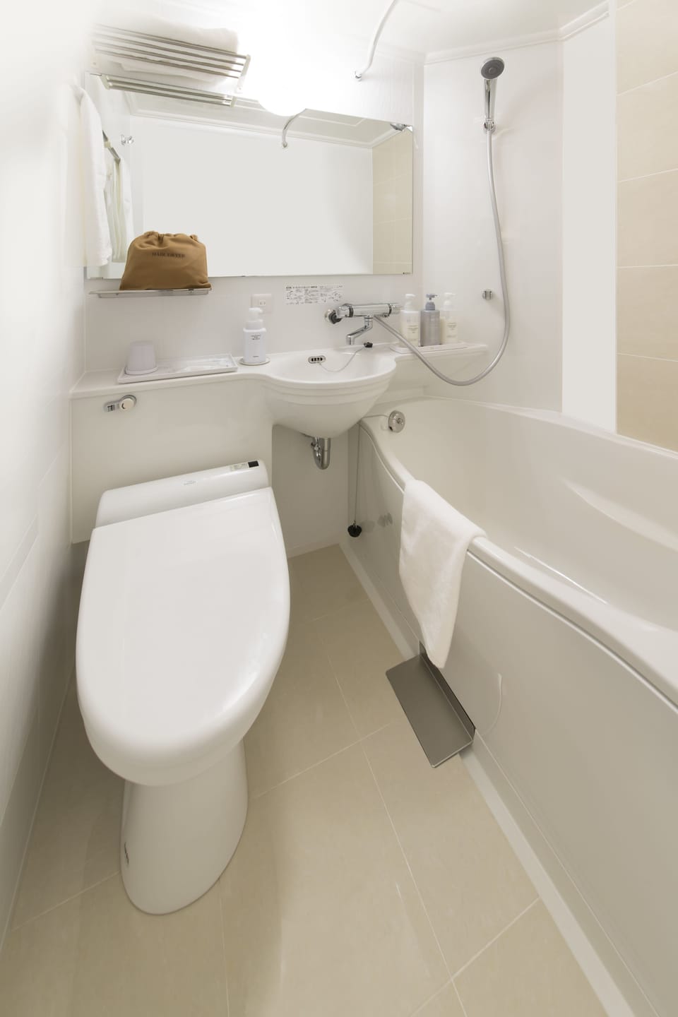 Combined shower/tub, free toiletries, hair dryer, slippers