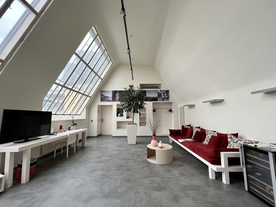 Exclusive Loft, City View | Living area | 50-inch flat-screen TV with satellite channels, TV