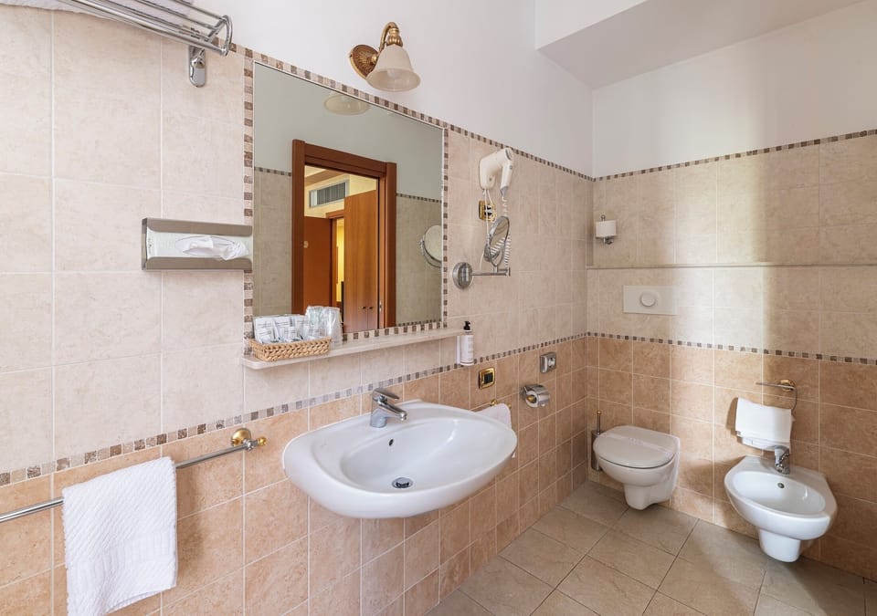 Shower, free toiletries, hair dryer, slippers