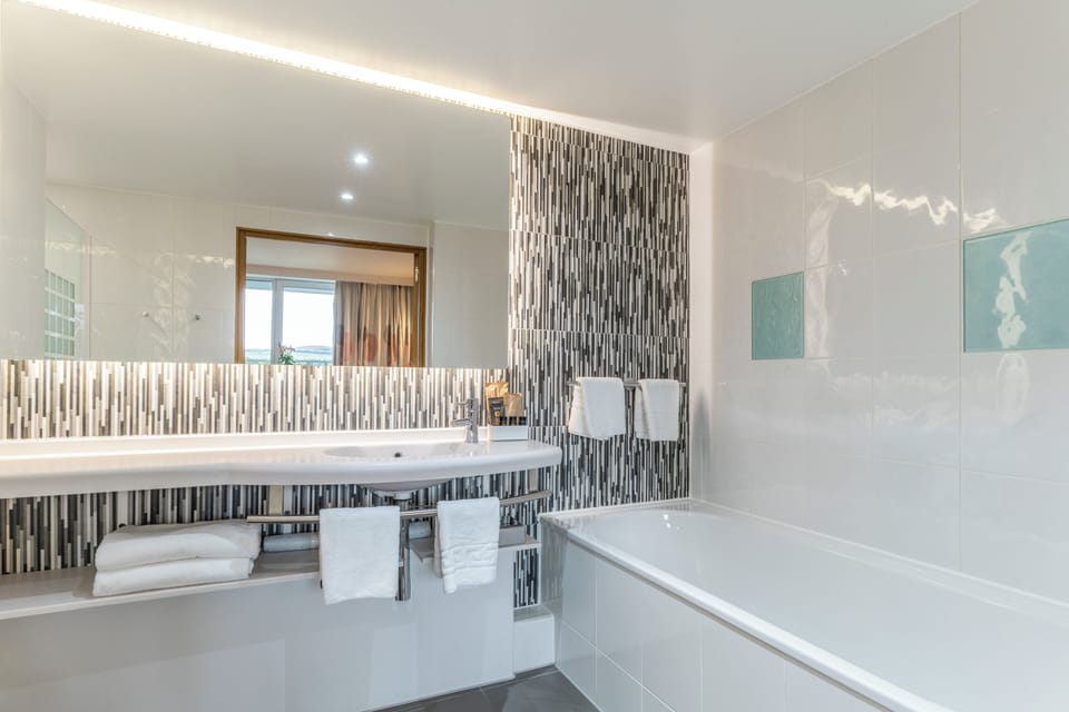 Designer toiletries, hair dryer, towels, soap