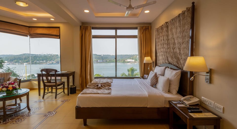 Superior Room, River View | Living area | 32-inch flat-screen TV with satellite channels, TV