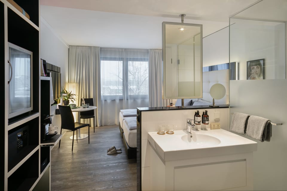 The Innside Premium Room | Bathroom | Eco-friendly toiletries, hair dryer, towels, soap