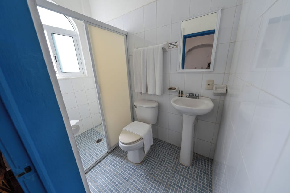 Shower, free toiletries, towels, soap