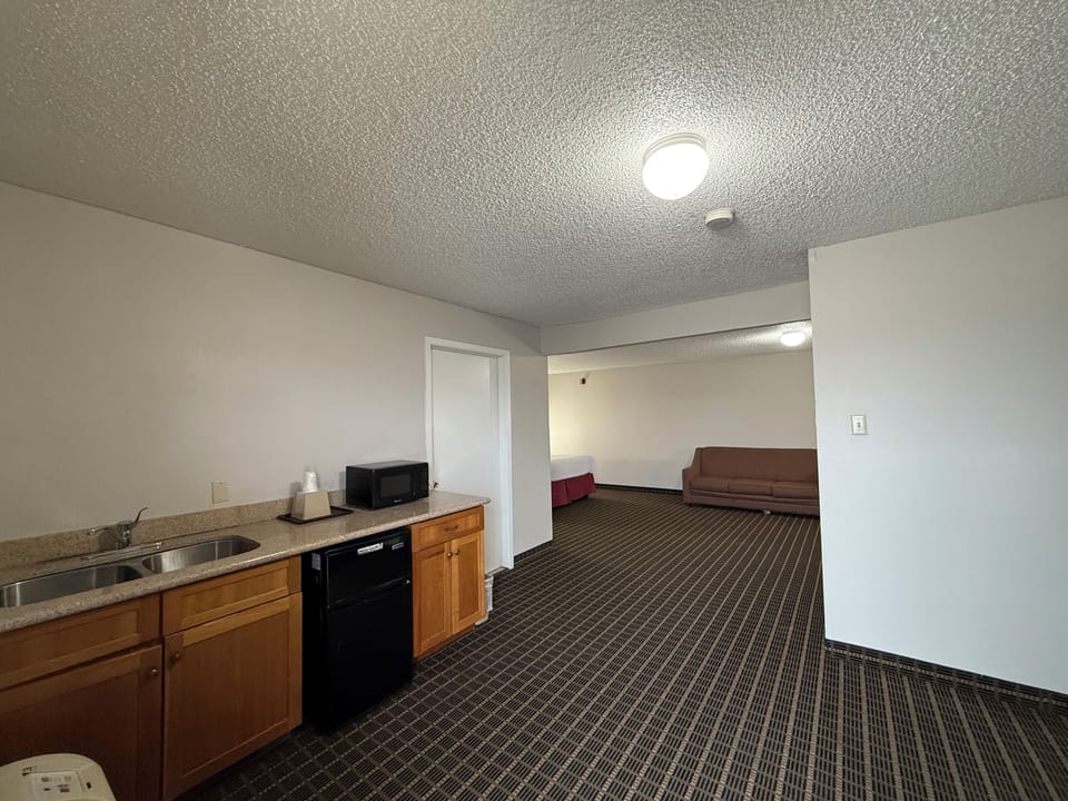 Studio Suite, 1 King Bed, Non Smoking | Desk, blackout drapes, iron/ironing board, free cribs/infant beds
