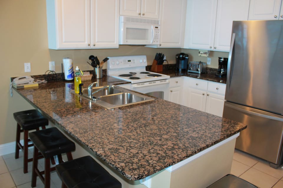 Condo, 2 Bedrooms, Balcony, Beachfront | Private kitchen | Full-size fridge, microwave, oven, stovetop